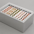 Dessert Shop Display Case With Assorted Colorful Macarons And Neatly Arranged Treats