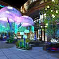Jellyfish Shaped Floral Installation With Purple Pink Blooms Green Trees And Lighting In Mall Atrium