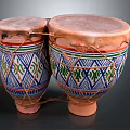 Pair of Traditional Bongo Drums With Colorful Geometric Patterns And Woven Ropes