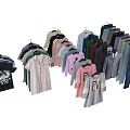 Hanging Clothes Collection Featuring Various Styles T Shirts Shirts And Jeans