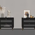 Black Bedside Tables With Gold Legs And Decorative Items Like Sculpture And Framed Art