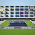 Modern School Buildings Featuring Green Roofs Sports Field Basketball Courts and Surrounding Trees