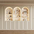Elegant Modern Wine Cabinet With Arched Glass Doors Interior Lighting And Displayed Bottles