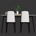 Modern Dining Table Set with Four White Chairs Black Legs Marble Top and Green Plant