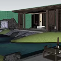 Rockery Stones In Serene Garden With Waterfall Pond And Pavilion Surrounded By Green Plants