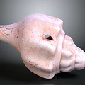 Pinkish Speckled Stone Conch Shell Sculpture With Textured Surface Carved Details And Central Hole