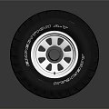 Black Car Tire With Silver Alloy Rim And Tread Pattern Design