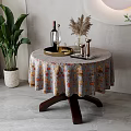 Round Dining Table With Floral Tablecloth Wine Bottle Glass Pampas Grass Candle Holders And Plants