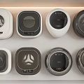 Modern Washing Machines With Various Designs And Colors Displayed On Shelf