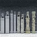 Various Styles Of Stone Carved Pillars With Grey Brick Wall And Floor