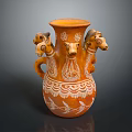 Decorative Orange Vase With Multiple Animal Heads And Intricate White Patterns 3d model