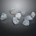 Several Natural Gray Stones With Rough Surface Texture On Dark Background