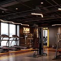 Modern Fitness Gym Interior Featuring Treadmills Workout Equipment Large Windows And Bright Lighting