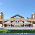Red Brick School Building With Arched Windows Front Lawn And Symmetrical Towers Grand Facade Design