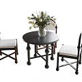 Round Dark Wooden Dining Table With Three Light Upholstered Chairs And White Flower Vase
