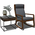 Single Rocking Armchair with Wooden Frame Gray Cushion and Side Table Table Lamp Green Plant