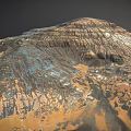 Desolate Rocky Mountain Landscape With Layered Terrain Gullies And Multicolored Hues In Brown Orange Blue