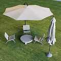Outdoor Table and Chairs Set on Green Grass with Beige Umbrella and Folded Parasol