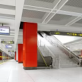 Modern Subway Station Interior With Red Pillars Staircase Escalators And Direction Signs