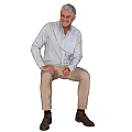 White Haired Man Wearing White Shirt Beige Pants And Brown Shoes Sitting Against Black Background