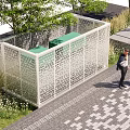 Outdoor Lounge Space With White Perforated Screen Green Seating And Trees