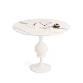 Round White Marble Dining Table With Natural Veins Magazines Teacup On White Pedestal Base