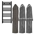 Three Comfortable Gray Robes Hanging Next To Black Towel Rack
