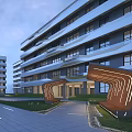 Modern School Building Exterior With Glass Facade Arched Entrance And Green Lawn Pathway