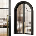 Arched Swing Door With Black Frame Glass Panels And Golden Handles