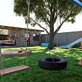 Garden Landscape with Wooden Roof Stone Wall Patio Dining Area Playground and Sunlit Lawn