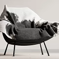 Modern Accent Chair Covered With Black White Ombre Throw Blanket And Sleek Black Metal Legs