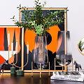 Glass Vase With Green Plants And Modern Decor Elements Including Painting Candle Holder And Mirror