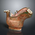 Ancient Ceramic Animal Shaped Vessel With Carved Patterns And Green Accents