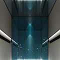 Sleek Modern Elevator Interior With Glass Walls Blue Lighting And Decorative Dots
