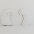 Two White Carved Sculptures With Wave Shaped Design And Curved Details