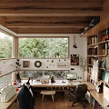 Cozy Study Room Interior With Large Windows Overlooking Green Trees And Bookshelves Filled With Books