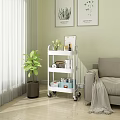 Rolling Storage Cart With Three Shelves In Living Room Plants Books And Decor Items