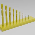 Industrial Equipment Yellow Drill Bits Set With Various Sizes Organized On Stand