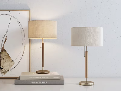 Stylish Table Lamps With Beige Shades Wooden Metal Poles Brass Bases Stacked Books Wall Art 3d model
