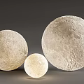 Different Sizes Off-White Spherical Decorative Lamps Featuring Moon Textured Surface And Inner Glow