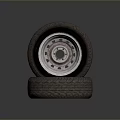 Stacked Car Tires Displaying Exposed Metal Rim And Detailed Tread Design