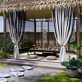 Chinese Pergola with Thatched Roof in Traditional Courtyard Surrounded by Lotus Flowers and Stone Path