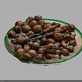 Assorted Mixed Nuts Placed On A Glass Plate With Orange Nutcracker