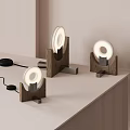 Three Modern Table Lamps With Wooden Base And Ring Shaped Light On Tabletop