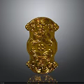 Golden Carved Decorative Plaque Featuring Intricate Ornate Facial And Floral Designs With Reflective Surface