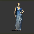 Man In Stylish Blue Long Dress Standing Against Neutral Studio Backdrop