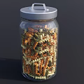Clear Glass Jar With Silver Lid Filled With Colorful Spiral Pasta
