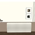 Bed in Background with White Padded Headboard Beige Wall Two Framed Paintings and Wooden Floor