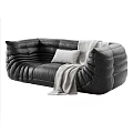 Black Leather Sectional Sofa With Padded Textured Design Light Blanket And Pillow