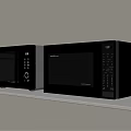 Two Modern Black and Silver Microwave Ovens Placed on White Shelf